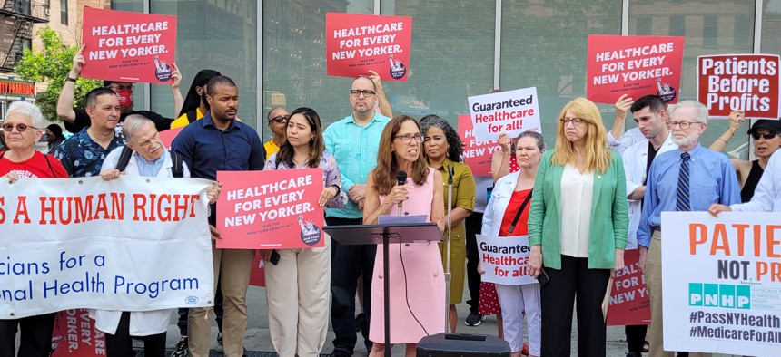 Assembly Member Amy Paulin speaks at a press conference in Harlem announcing the reintroduction of the New York Health Act.