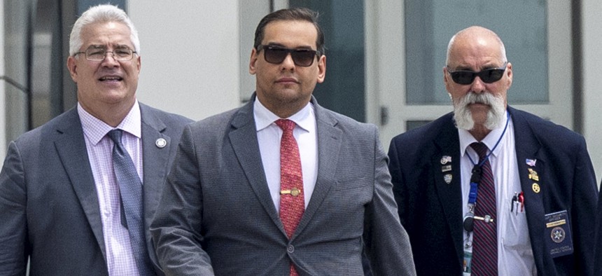 Rep. George Santos (center) departs federal court with his attorney Joseph Murray (left) on June 30, 2023, in Central Islip, NY.
