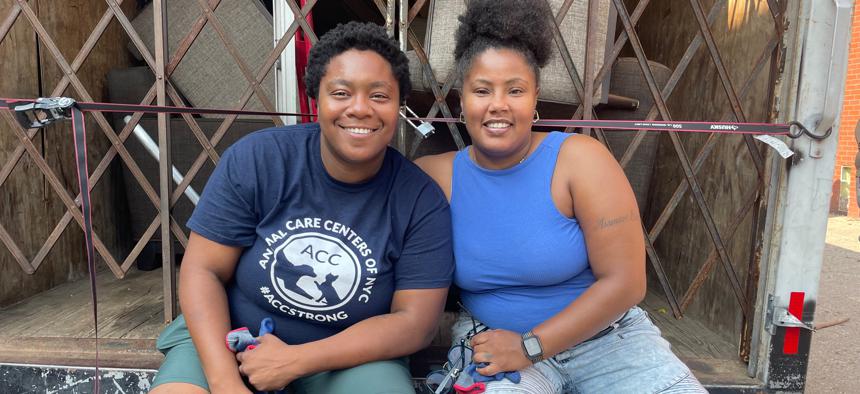 Vanessa Santiago (right) and  Erika "Sean" McFolling on their delivery truck on July 12, 2023.