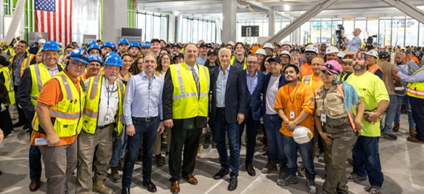 JPMorgan Chase CEO Jamie Dimon (center) with Gary LaBarbera, president of the Building and Construction Trades Council of Greater New York (left of center) visit 270 Park Ave., the bank's new global headquarters under construction in midtown Manhattan.