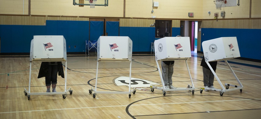 The newly approved voting machines lack the traditional paper ballots of the current system.