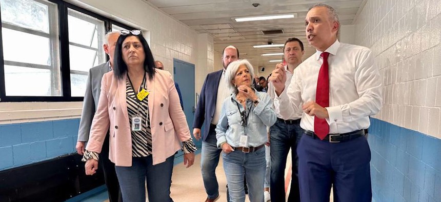 From left, City Council Members Bob Holden, Joann Ariola, David Carr, Vickie Paladino and Ari Kagan hear from Department of Correction Commissioner Louis Molina. 