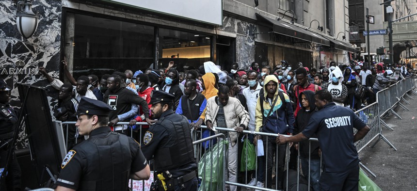 In early August, migrants lined up outside Roosevelt Hotel in midtown Manhattan while waiting for placement in a shelter.