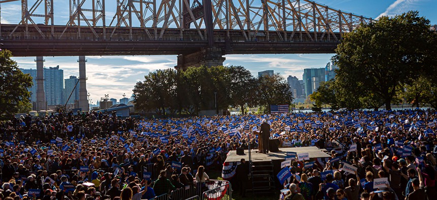 Bernie Sanders supporters gather at a large rally in western Queens.