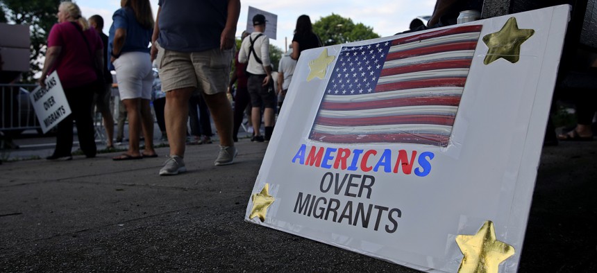People attend a protest against a tent city set up for migrants at Creedmoor Psychiatric Center on August 16, 2023 in Queens, New York. The latest Siena College poll shows issues like migration are having a negative impact on the Democratic Party.