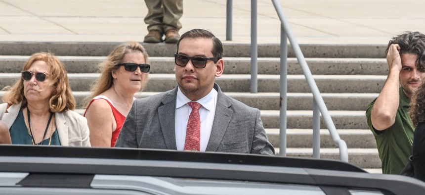 Rep. George Santos, pictured here outside a Long Island federal courthouse, pleaded not guilty to 13 counts of fraud and other corruption charges.