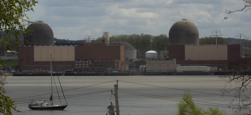 A boat sails on the Hudson River in front of the Indian Point nuclear power plant.