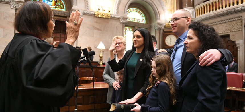 Former state Sen. Diane Savino, right, attends the swearing in ceremony of her successor and former staffer Jessica Scarcella-Spanton.