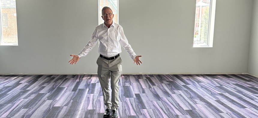Todd Fliedner, executive director at the Bay Ridge Center, shows a newly carpeted room inside the center's new building at 15 Bay Ridge Ave.
