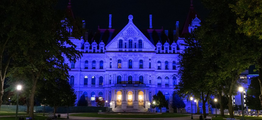 The New York State capitol building in Albany cast in purple lighting on Oct. 1, 2022 for National Domestic Violence month