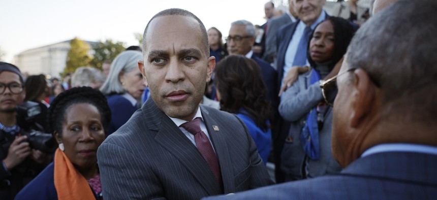 Rep. Hakeem Jeffries speaks with fellow House Democrats outside the U.S. Capitol on Oct. 13, 2023.