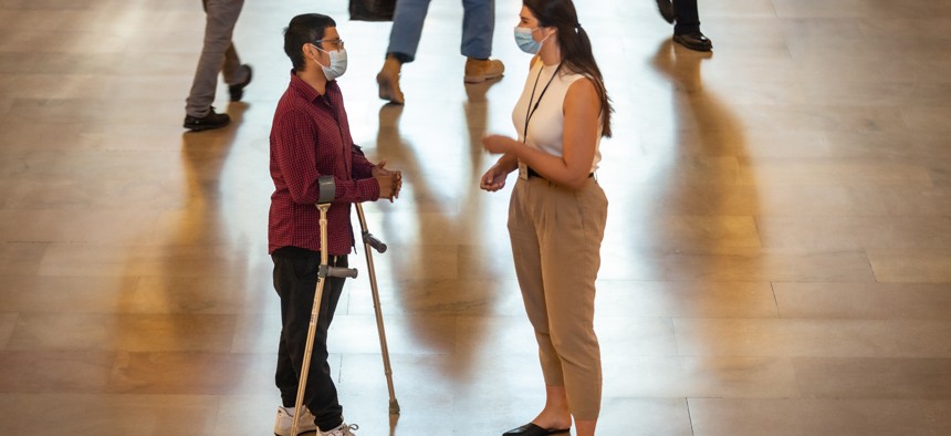 Bridges from School to Work pairs mentors with students with disabilities as they transition into the workplace. Here Henry Calle works with his Bridges rep, Anna Sammons. 