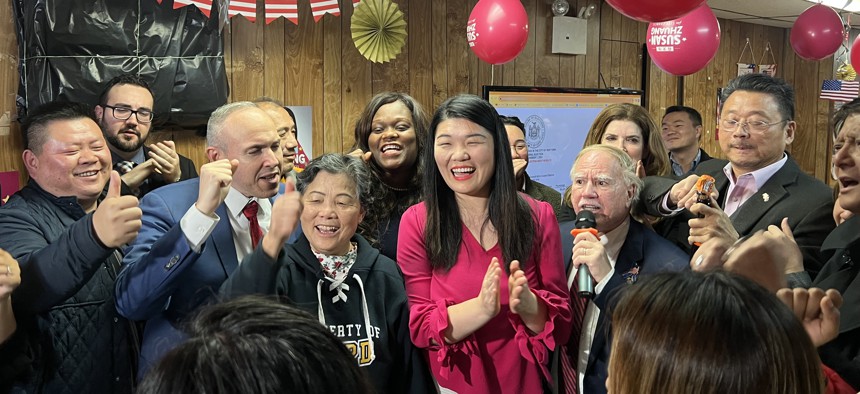 Susan Zhuang (center) with Brooklyn Democratic Party Boss Rodneyse Bichotte Hermelyn (left of center), and other supporters at Zuang’s election campaign party Tuesday night. 