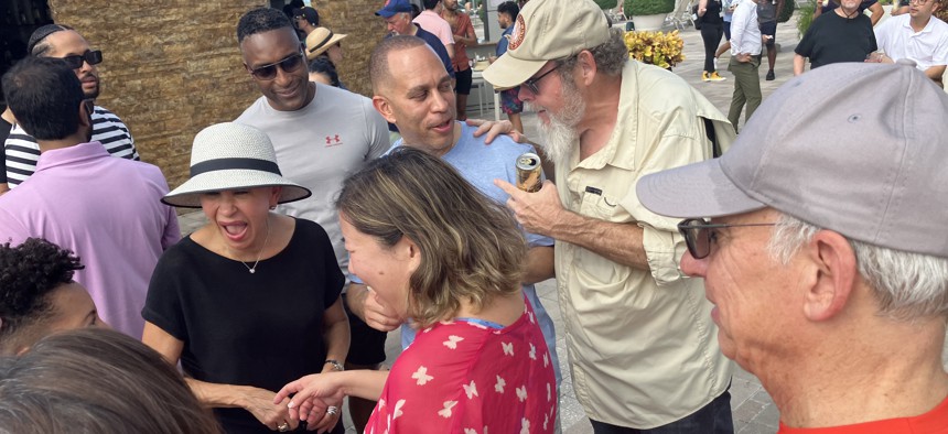 Reps. Nydia Velázquez, Grace Meng and Hakeem Jeffries at a rooftop pool party Saturday afternoon.