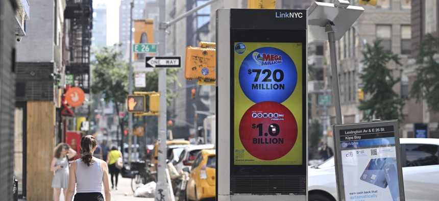 A LinkNYC kiosk shows the Mega Millions and Powerball lottery grand prizes on July 19, 2023.