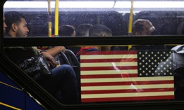 Asylum-seekers board on a bus en route to New York City in 2023.