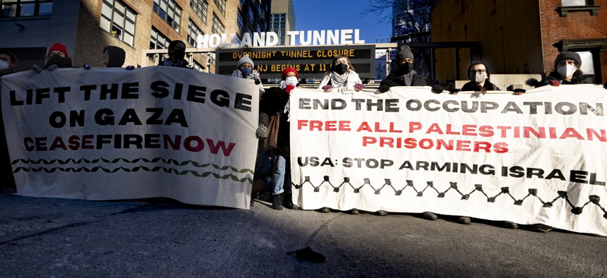 Pro-Palestinian protesters block the entrance of the New Jersey-bound entrance into the Holland Tunnel in lower Manhattan on Jan. 8, 2024