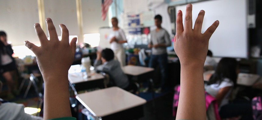 Children ask questions during an after-school program at P.S. 199 in Queens. 