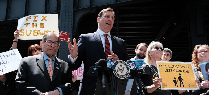 Rep. Dan Goldman (center) speaks at a rally in support of congestion pricing on April 21, 2023.