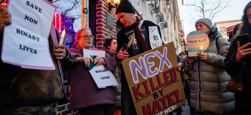 New Yorkers hold a vigil for Nex Benedict, a nonbinary teenager who died after being beaten in a high school bathroom, outside The Stonewall Inn in Manhattan.
