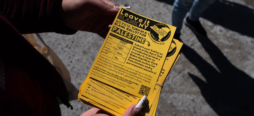An organizer holds flyers promoting New York’s “Leave it Blank” campaign.