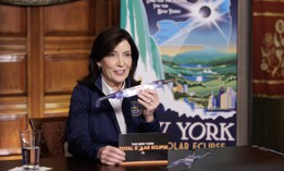 Gov. Kathy Hochul is celebrating the total solar eclipse in Niagara Falls while the budget continues being extended.