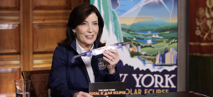 Gov. Kathy Hochul is celebrating the total solar eclipse in Niagara Falls while the budget continues being extended.