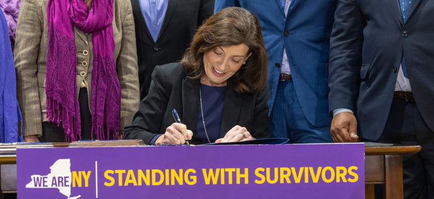 Gov. Kathy Hochul signs a series of bills strengthening support and protections for domestic violence survivors on Oct. 18, 2022.