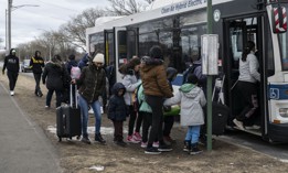Migrants get on a bus outside Floyd Bennett Field in Brooklyn.