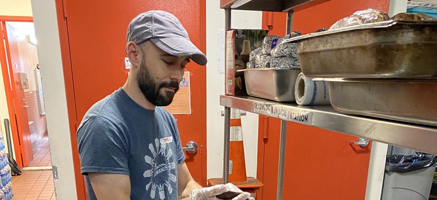 Peter Endriss, executive director of Community Help in Park Slope, also known as CHIPS, prepares sandwiches at the nonprofit 