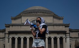 A pro-Palestinian student protester speaks to a crowd at Columbia University on April 29, 2024.