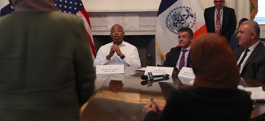 Executive Director of the Mayor's Office of Ethnic and Community Media José Bayona sits to the right of Mayor Eric Adams at a Muslim community media roundtable to discuss Ramadan and topics related to the community at City Hall on March 13, 2023. 