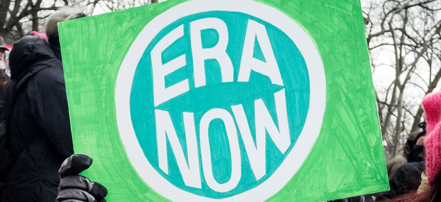 A marcher holds an “ERA NOW” sign during the 2020 Women’s March in New York City.