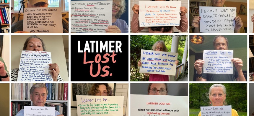 Members of “Westchester Progressives” hold signs explaining why they are no longer supporting George Latimer