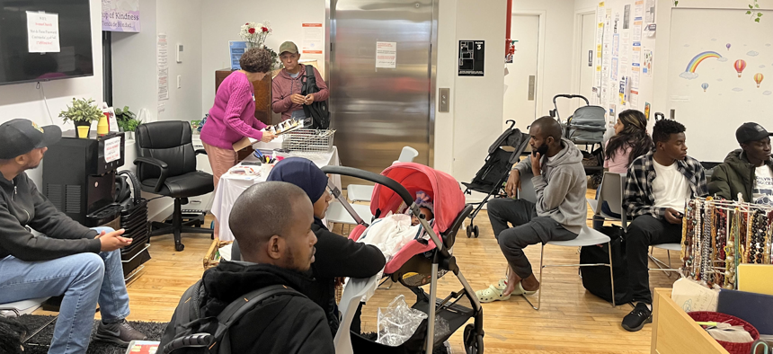 Dozens of migrants wait to be helped at Team TLC-NYC, a nonprofit organization that provides legal services for migrants applying for work permits