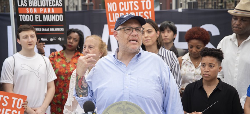 City Council Finance Committee Chair Justin Brannan speaks at a rally against cuts to libraries.