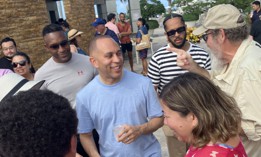Rep. Hakeem Jeffries (center) with top adviser André Richardson (second from right) in Somos.