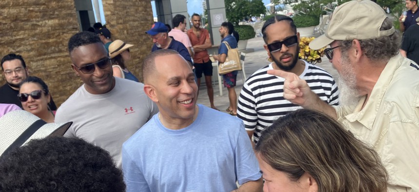 Rep. Hakeem Jeffries (center) with top adviser André Richardson (second from right) in Somos.