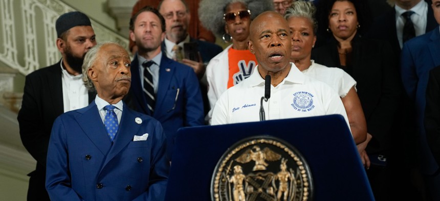 New York City Mayor Eric Adams and Rev. Al Sharpton at a press conference at City Hall on Sunday denouncing gun violence and extremism after the attempted assassination of Donald Trump.