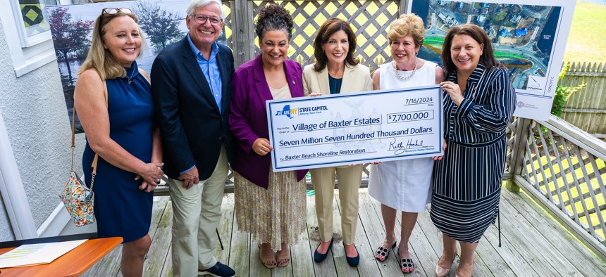 Gov. Kathy Hochul presents an oversized novelty check for shoreline restoration on July 16, 2024.