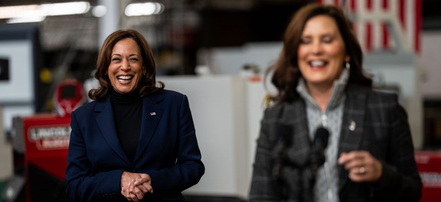 Vice President Kamala Harris (left) smiles as Michigan Gov. Gretchen Whitmer (right) delivers remarks on Oct. 15, 2022.