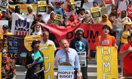 New York City Comptroller Brad Lander speaks at a rally against Mayor Eric Adams’ proposed budget cuts in June.