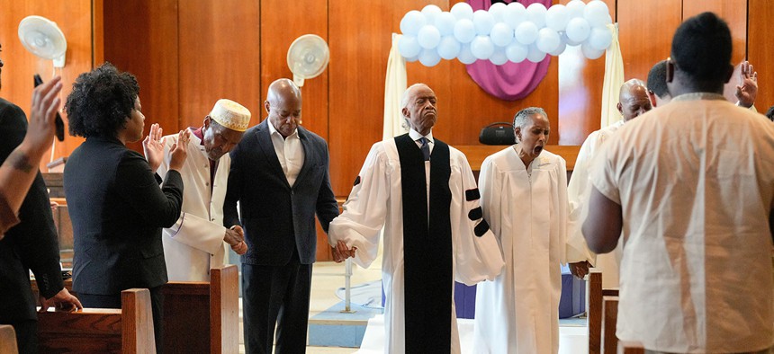 New York City Mayor Eric Adams was baptized on Rikers Island by the Revs. Al Sharpton and Herbert Daughtry.