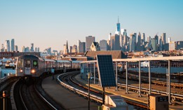 Train arriving to a metro station in Brooklyn.