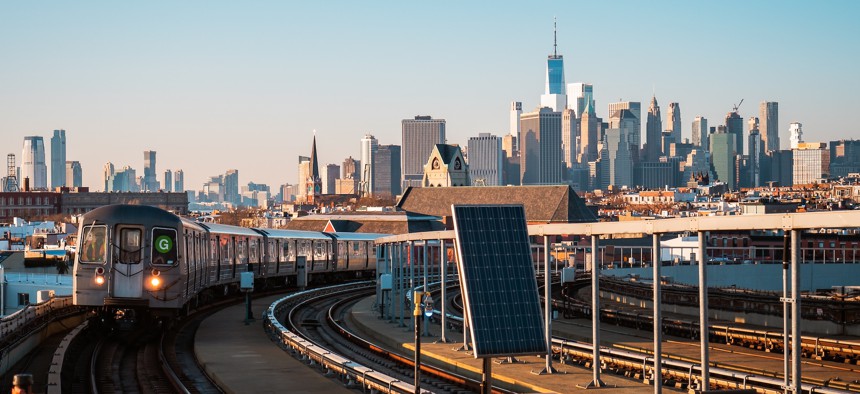 Train arriving to a metro station in Brooklyn.