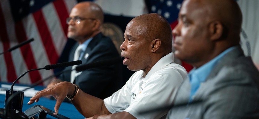 Schools Chancellor David Banks (left) and Deputy Mayor for Public Safety Phil Banks (right) attend a public safety briefing with Mayor Eric Adams (center). Their brother, consultant Terence Banks, is being investigated for allegedly trading on his proximity to power.