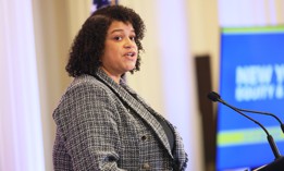 Assembly Member Michaelle Solages speaks after Gov. Kathy Hochul signs a bill creating a commission to study reparations in New York on Dec. 19, 2023.