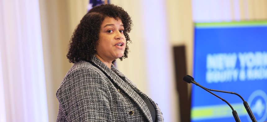 Assembly Member Michaelle Solages speaks after Gov. Kathy Hochul signs a bill creating a commission to study reparations in New York on Dec. 19, 2023.