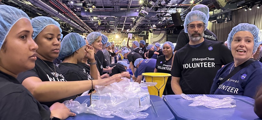 JPMorgan Chase employees volunteer at a day of service organized by the nonprofit 9/11 Day to remember the 23rd anniversary of the Sept. 11 terrorist attacks.