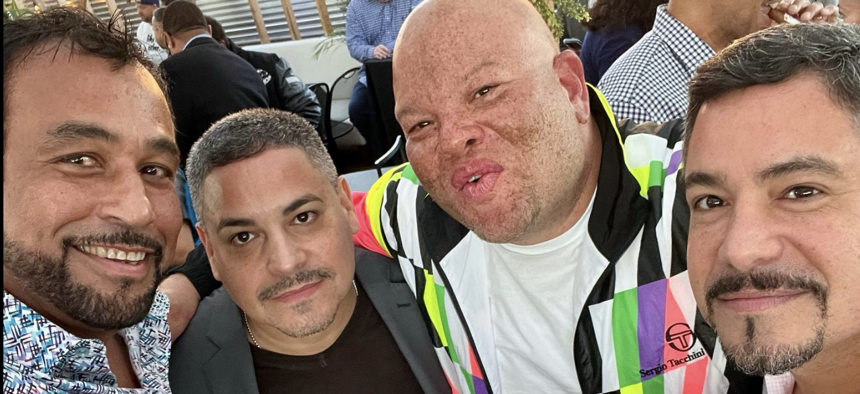 Restaurateur Jimmy Rodriguez, left, with NYPD Commissioner Edward Caban, second from left, and his twin brother James Caban, right.